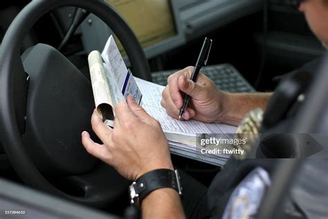 Police Officer Writing Ticket 2 High Res Stock Photo Getty Images