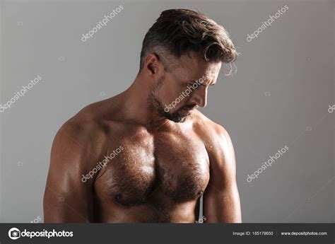 Close Up Portrait Of A Muscular Mature Shirtless Sportsman Stock Photo