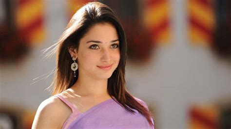 Beautiful Tamannaah Bhatia Is Wearing Purple Saree Standing In Colorful