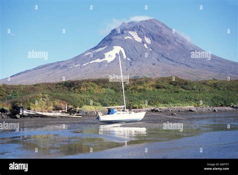 Sailboat Behind The Volcano Saint Augustine Cook Inlet Alaska Stock