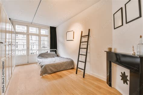 Bedroom interior with bed and wardrobe Stock Photo | Adobe Stock