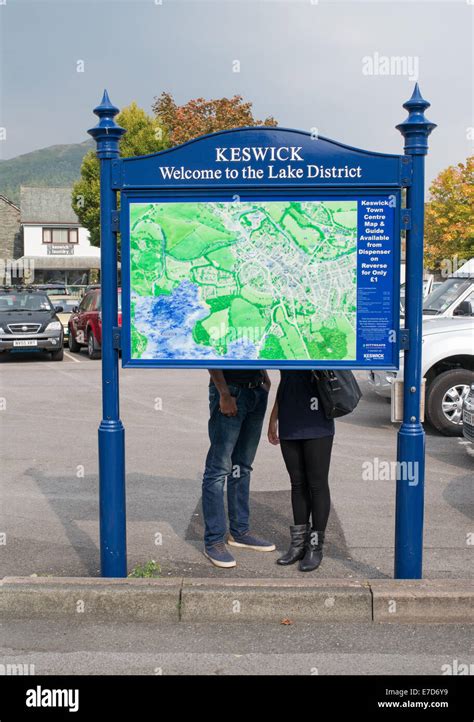 Keswick Town Map With The Legs Of A Couple Seen Behind Allerdale