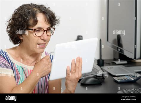 A Portrait Of A Mature Woman With A Digital Tablet Stock Photo Alamy