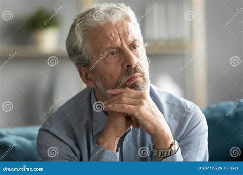 Unhappy Pensive Middle Aged Grandfather Feeling Lonely Indoors Stock