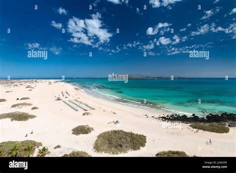 Aerial View Of Corralejo Beach And Dunes With Turquoise Water In