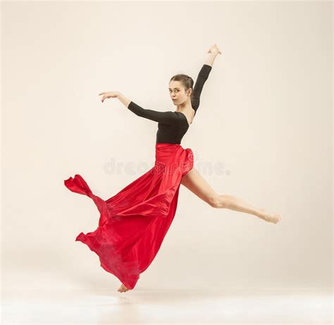 Modern Ballet Dancer Dancing In Full Body On White Studio Background