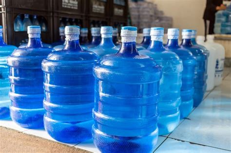 Premium Photo Plastic Big Bottles Or White And Blue Gallons Of