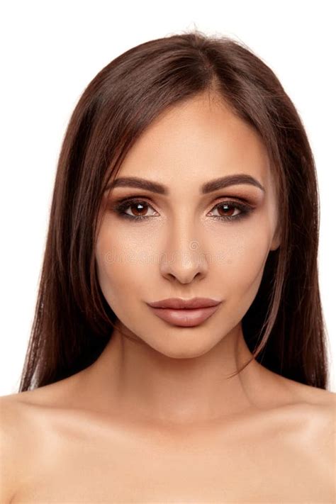 Close Up Portrait Of A Brunette Nude Model Girl With Professional Evening Make Up And Plump Lips