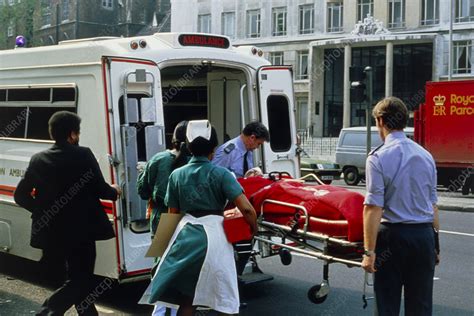 Man In Stretcher Put In Ambulance In Emergency Stock Image M526