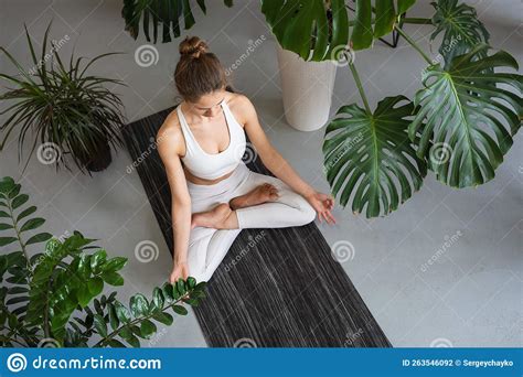 Woman Leading A Healthy Lifestyle And Practicing Yoga Doing Meditation