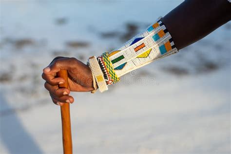 Maasai Dressed In Traditional Clothes Walking On The Beach Zanzibar