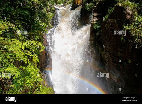 Close Up Of Splashing Waterfall In A Narrow Ravine With Rainbow Iguazu