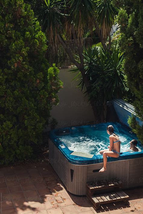 Girl Climbing Into Hot Tub Del Colaborador De Stocksy Cindy Prins Stocksy