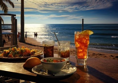 Premium Ai Image A Beachfront Restaurant Scene With Sex On The Beach Cocktails And A View Of