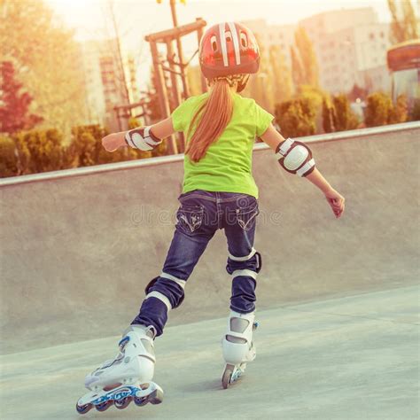 Back View Of Little Girl In Helmet On Roller Skates Stock Image Image