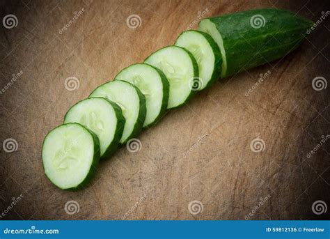 Fresh Cucumber Slices On Wooden Chop Board Stock Photo Image Of