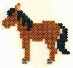 a brown horse made out of beads on a white surface with black dots around it