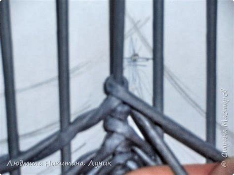 Someone Is Holding Their Hand Through The Bars Of A Caged Area That Has