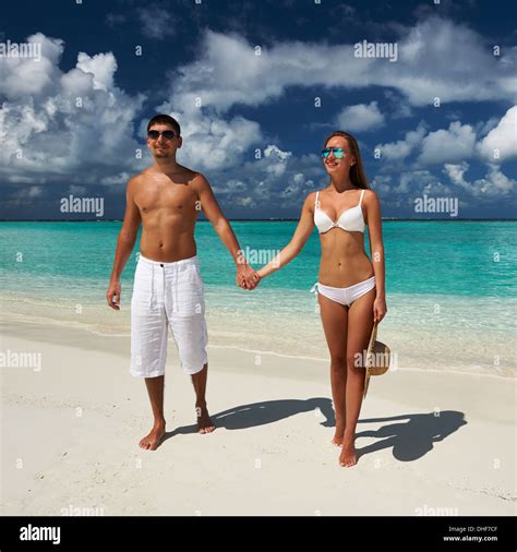 Couple on a beach at Maldives Stock Photo - Alamy