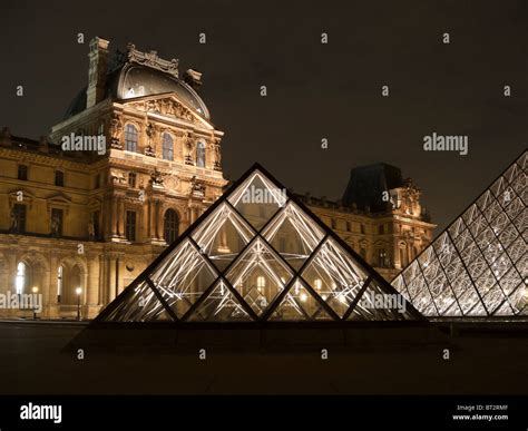 Louvre museum by night Stock Photo - Alamy