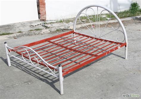 A Metal Bed Frame Sitting On The Ground