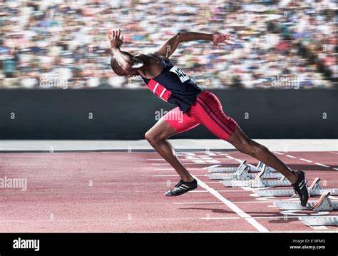 Sprinter Taking Off From Starting Block On Track Stock Photo Royalty