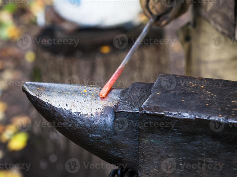 Red Hot Iron Rod On Anvil 12242742 Stock Photo At Vecteezy