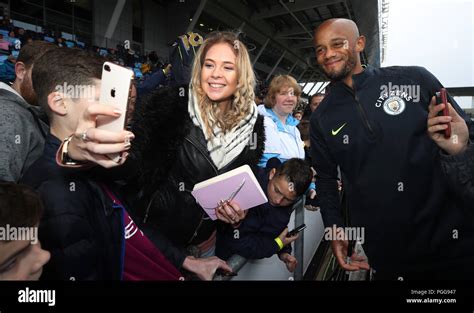 Manchester City S Vincent Kompany Signs Autographs For Fans During The