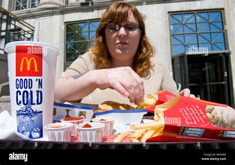 Overweight Woman Eating McDonald S Fast Food Meal Stock Photo Alamy