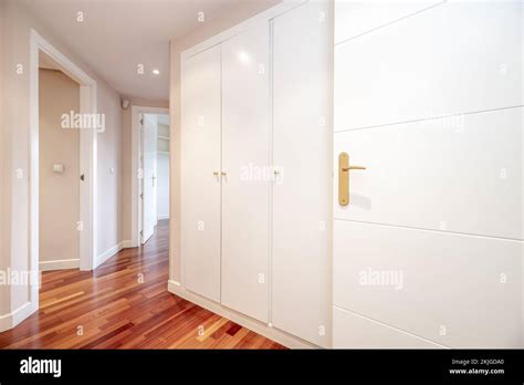 Distributor Corridor Of A House With White Carpentry And Built In