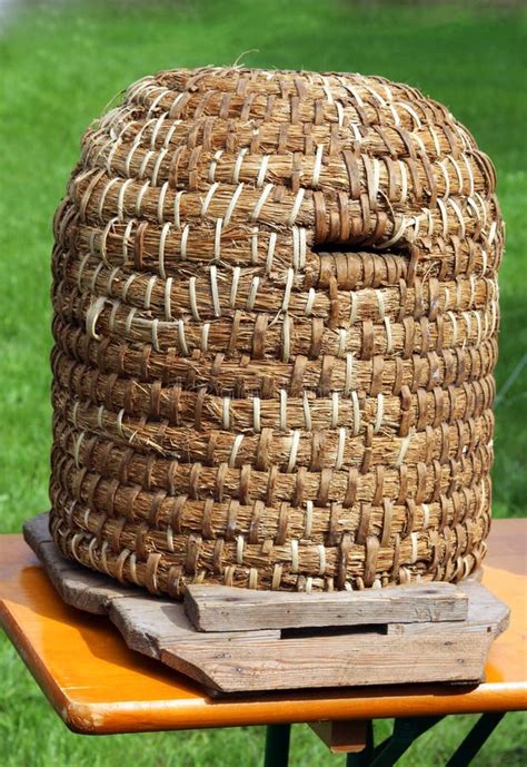 Old Straw Beehive Standing On A Wood Table Stock Photo Image Of Copy