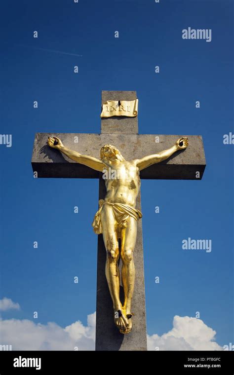 Golden Jesus Christ Crucifixion Statue Sunny Summer Day Blue Sky