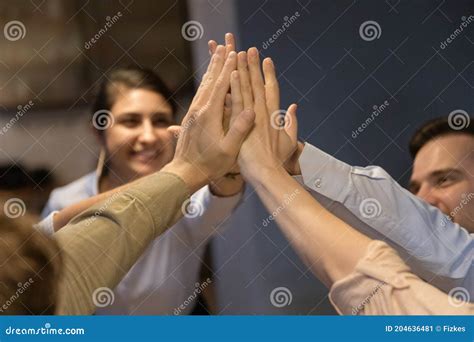 Excited Multiracial Employees Give High Five At Meeting Stock Image