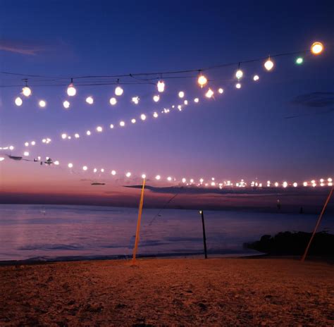 Image Of Close Up Of Outdoor Lights On String On Beach At Night