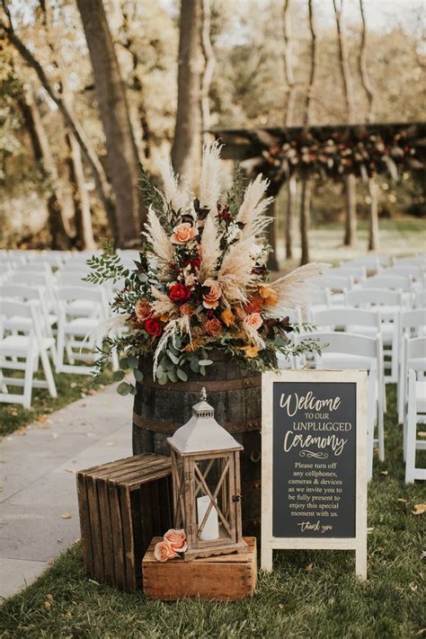 Photo Of Wedding Floral Arrangement In Fall Colors Including Pompas