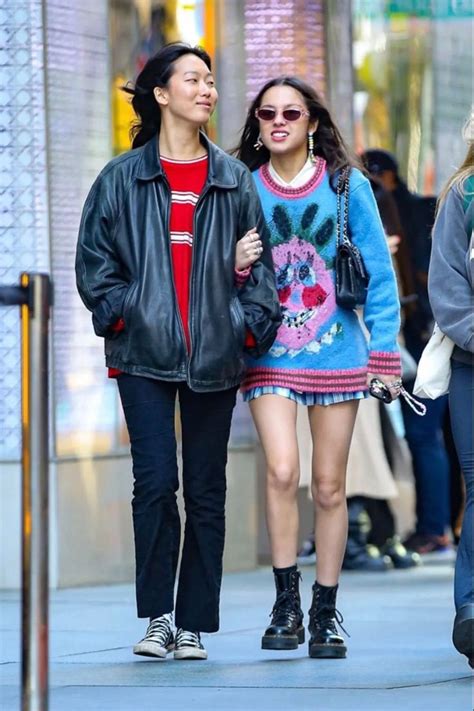 Two Women Walking Down The Street Together