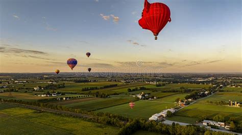 Aerial View Of Hot Air Balloons Floating Away One Is A Pigs Head In