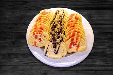 Premium Photo Swiss Roll Cake Stuffed With Cream Cheese Decorated