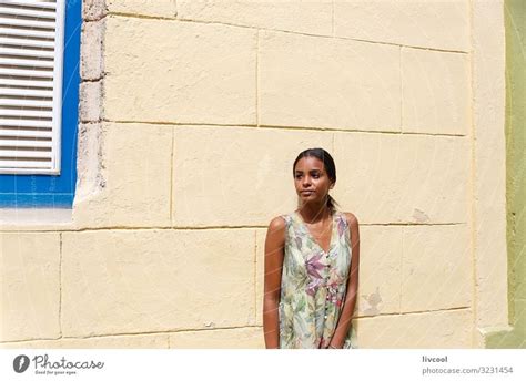 Young Cuban Girl Leaning On A Wall In Havana Cuba A Royalty Free