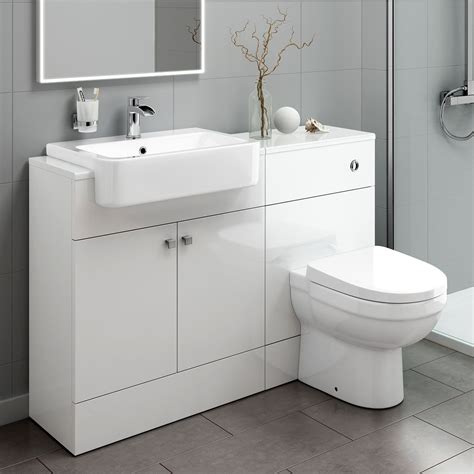 This Toilet And Sink Vanity Storage Unit Features A Built In Toilet And White Ceramic Bath