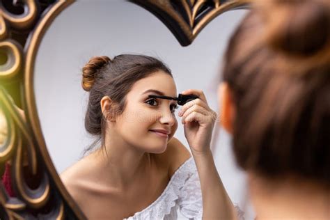 Woman Applying Makeup Beauty Product Putting Makeup Mascara In The