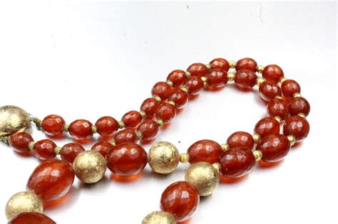 Vintage Cherry Amber Bakelite Pressed Gold Tone Bead Gem