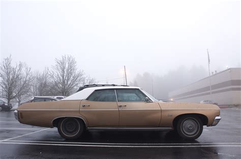 OLD PARKED CARS.: 1970 Chevrolet Impala 4-door hardtop.