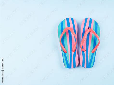 summer colorful flip flop pair  blue background beach vacation