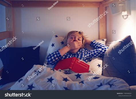 Young Boy Yawning While Laying Bed Stock Photo 1790369024 Shutterstock