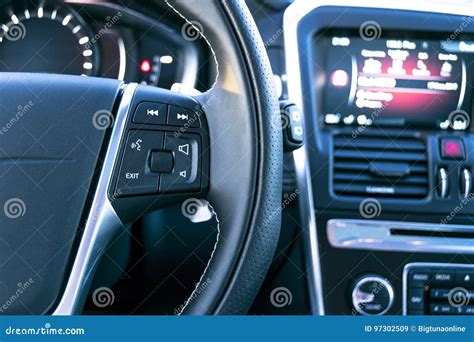 Media Control Buttons On The Steering Wheel In Black Leather With Computer Monitor Modern Car