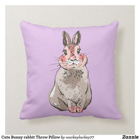 a purple pillow with a cartoon rabbit on it