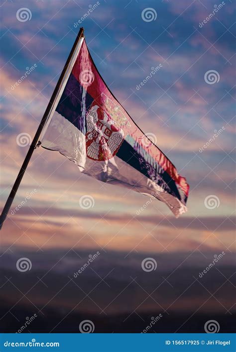 Serbia Flag Serbian Flag Waving On Sky At Dusk Stock Image Image Of