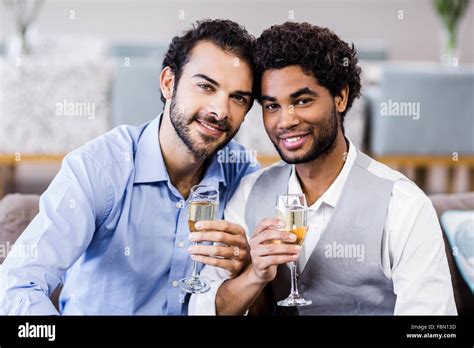 Happy Gay Couple Drinking Champagne Stock Photo Alamy