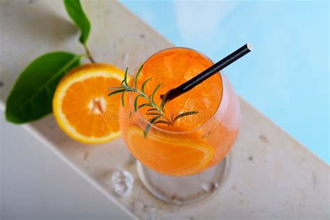 Classic Italian Aperitif Aperol Spritz Cocktail In Glass With Slice Of Orange By A Pool Summer